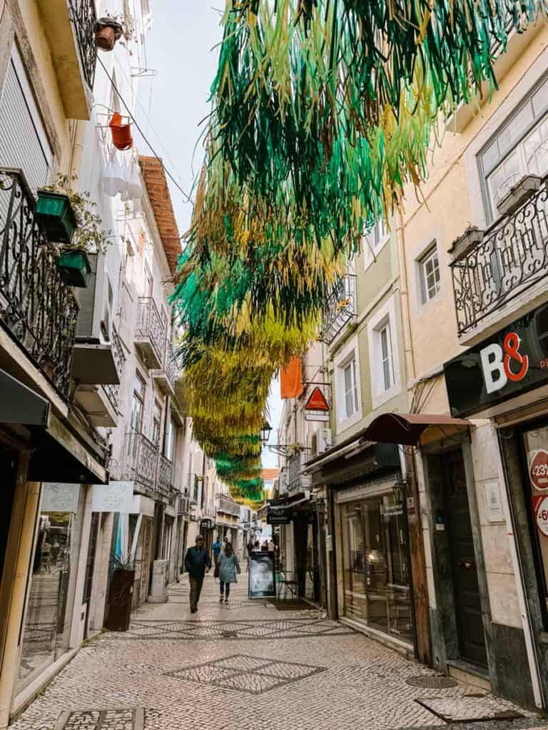 Shopping streets in Setúbal Portugal with green and yellow decorations