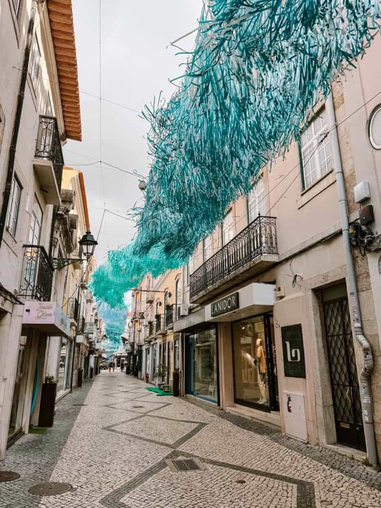 Shopping streets in Setúbal Portugal with blue green decorations