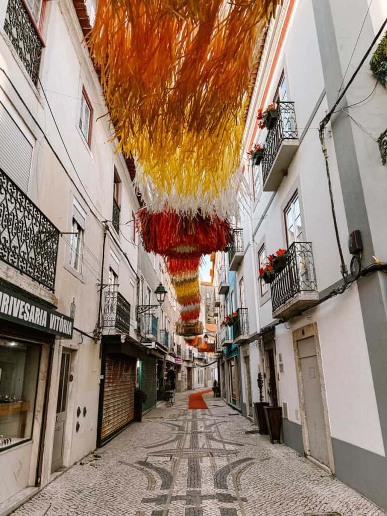 Shopping streets in Setúbal Portugal with red and yellow decorations