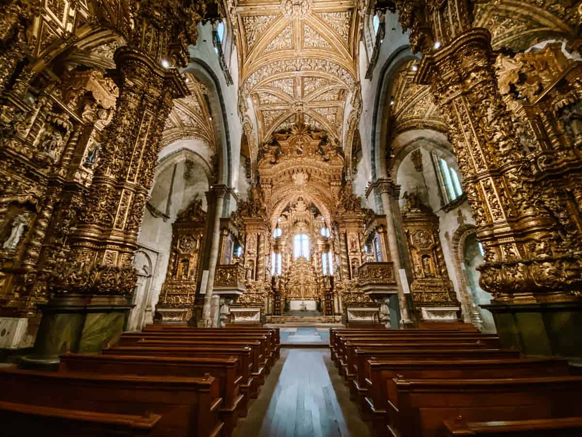 The interior of São Francisco Church Porto is covered with gold and wood work, divided over three naves and side chapels